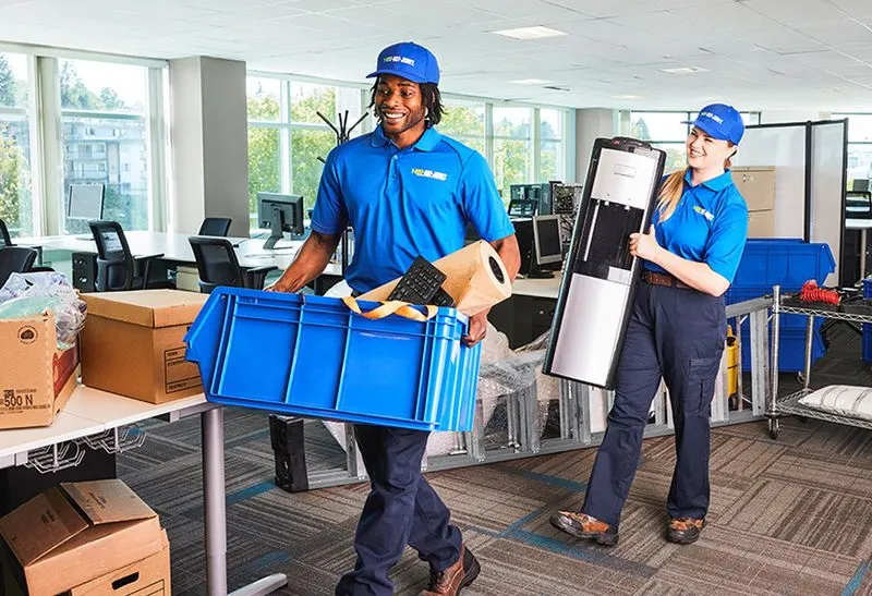 1-800-GOT-JUNK? crew handling an office cleanout