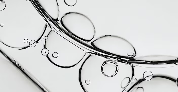 Close-up of a clear skincare serum texture with air bubbles